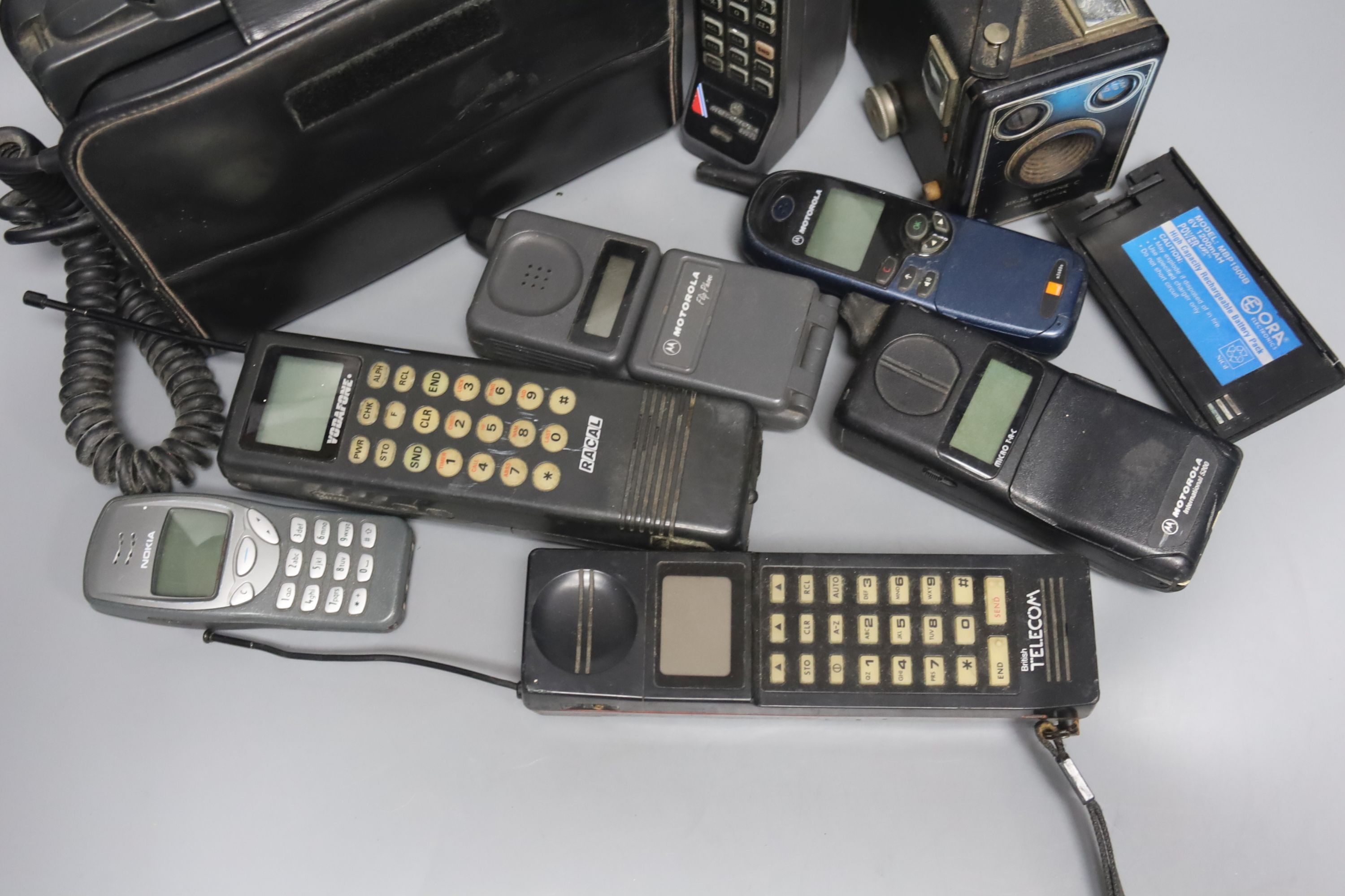 Eight early/retro mobile phones and a Box Brownie